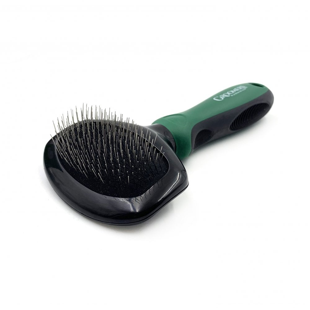 A slicker brush used in dog grooming